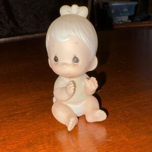 Precious Moments bisque porcelain figurine titled "Baby Girl Clapping Hands,"